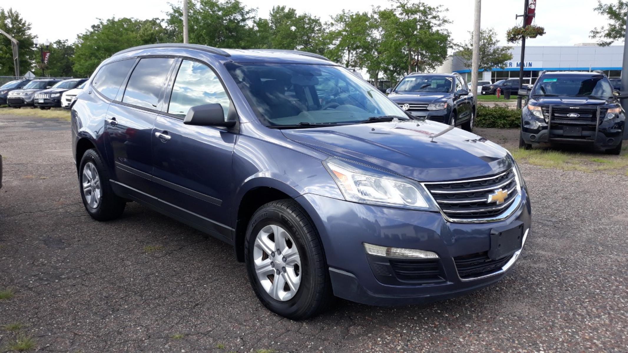 2014 Electronic Blue /GRAY Chevrolet Traverse LS FWD w/PDC (1GNKRFEDXEJ) with an 3.6L V6 DOHC 24V engine, 6-Speed Automatic transmission, located at 434 West Main Street, Anoka, MN, 55303, (763) 576-9696, 45.201759, -93.396706 - 3RD ROW SEAT!! 4 OWNER / NO ACCIDENTS MULTI-POINT "PERFORMANCE" INSPECTION PERFORMED: Transmission/clutch, Engine performance, Brakes, Steering, Heater/Air Conditioning, Instruments/Controls, Headlights/fog lights, Brake/back-up lights, Interior/warning lights, Turn signals/flashers MULTI-PO - Photo #2